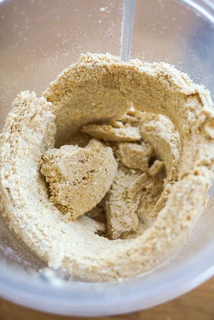 grind cashews and oats to make a crumbly flour