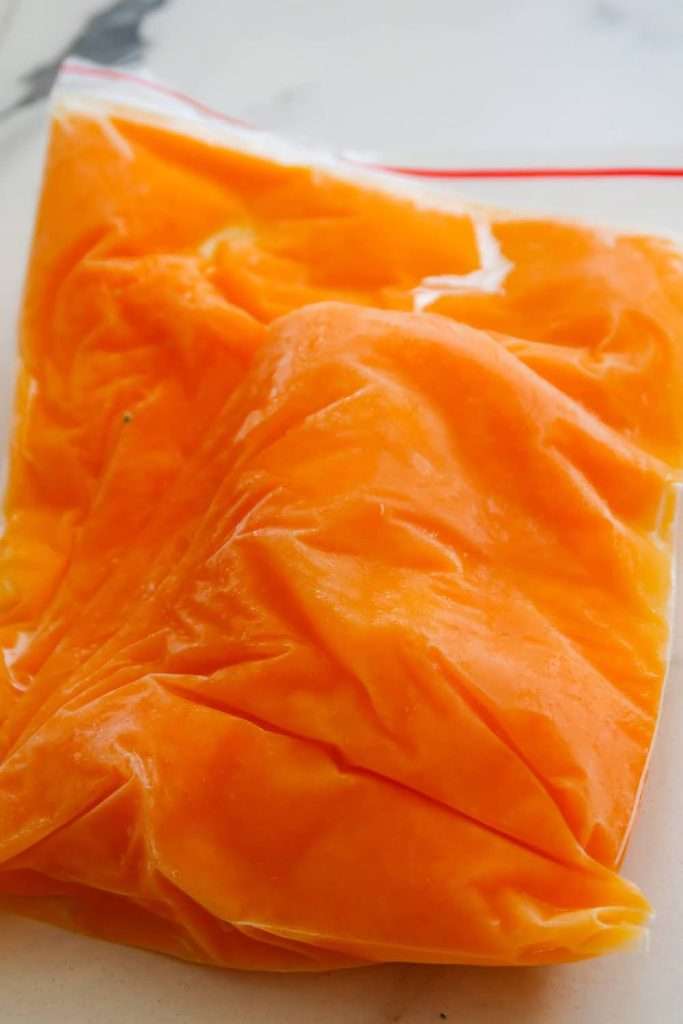 Preserve your harvest for months! Learn how to freeze butternut squash in two ways - 1) raw and chopped or 2) as butternut squash puree. 